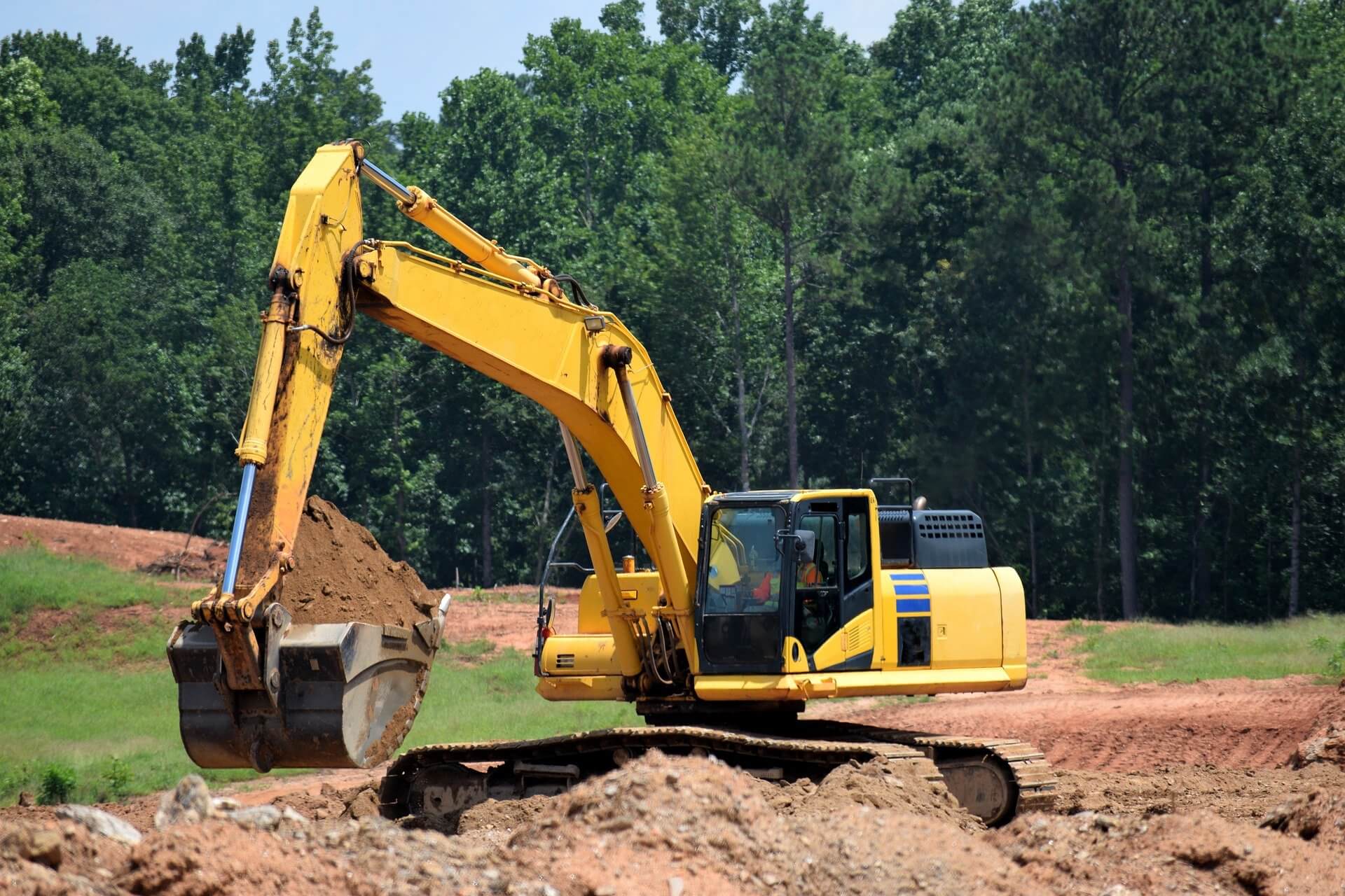 Stock photo of a construction site with a cat excavator.