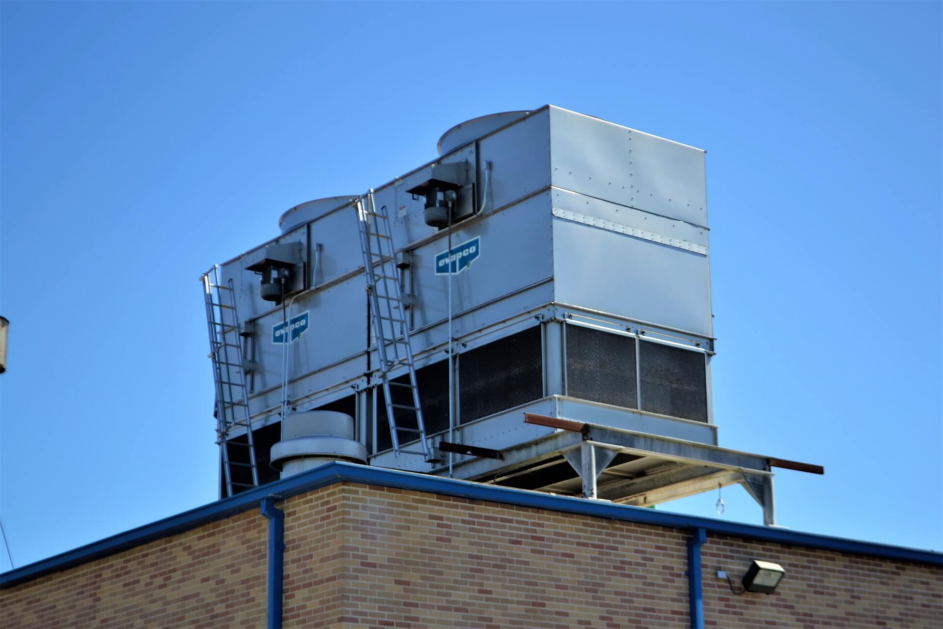 Stock HVAC Air conditioning and central air equipment on top of building.