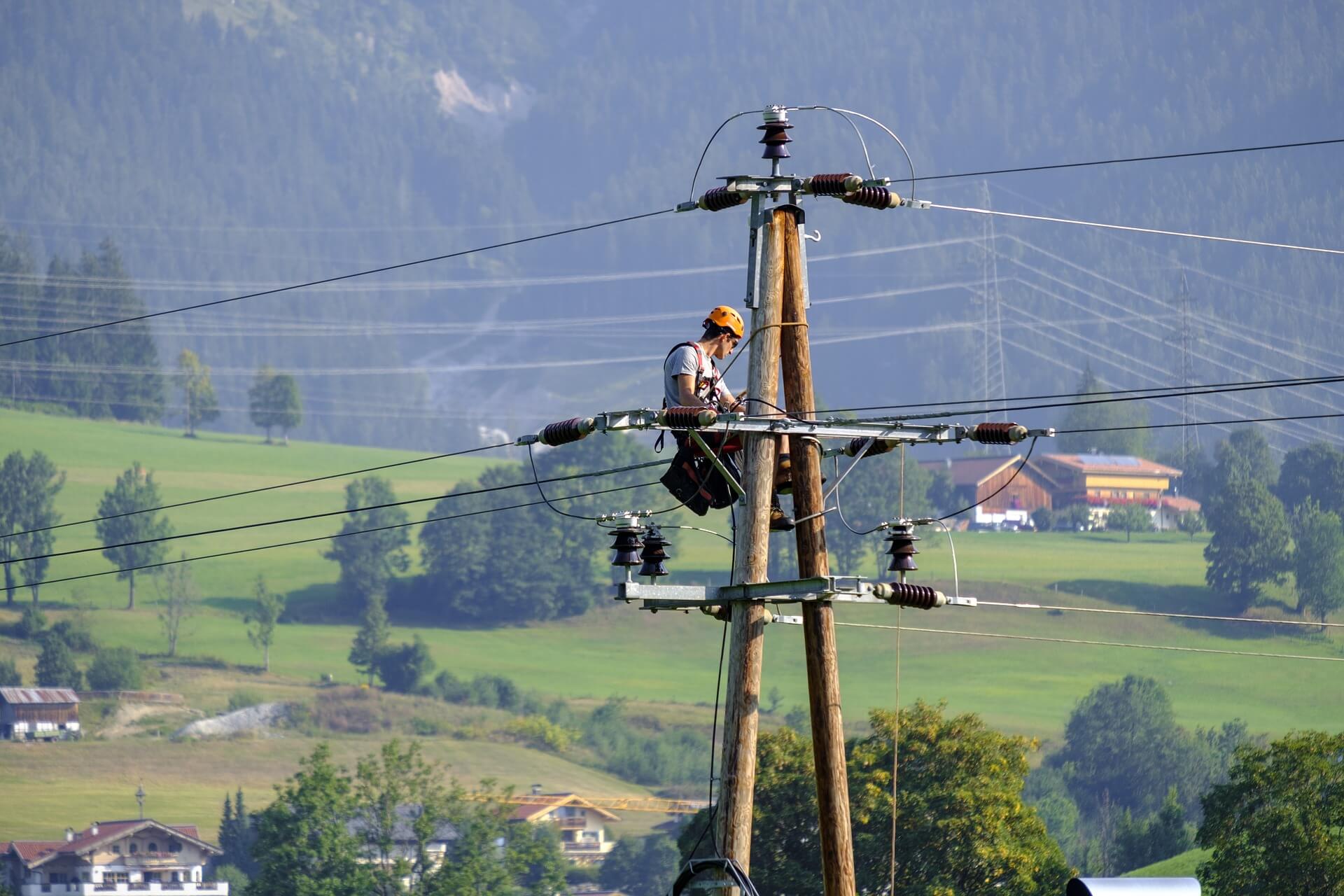 Electrical lineman working on powerlines.