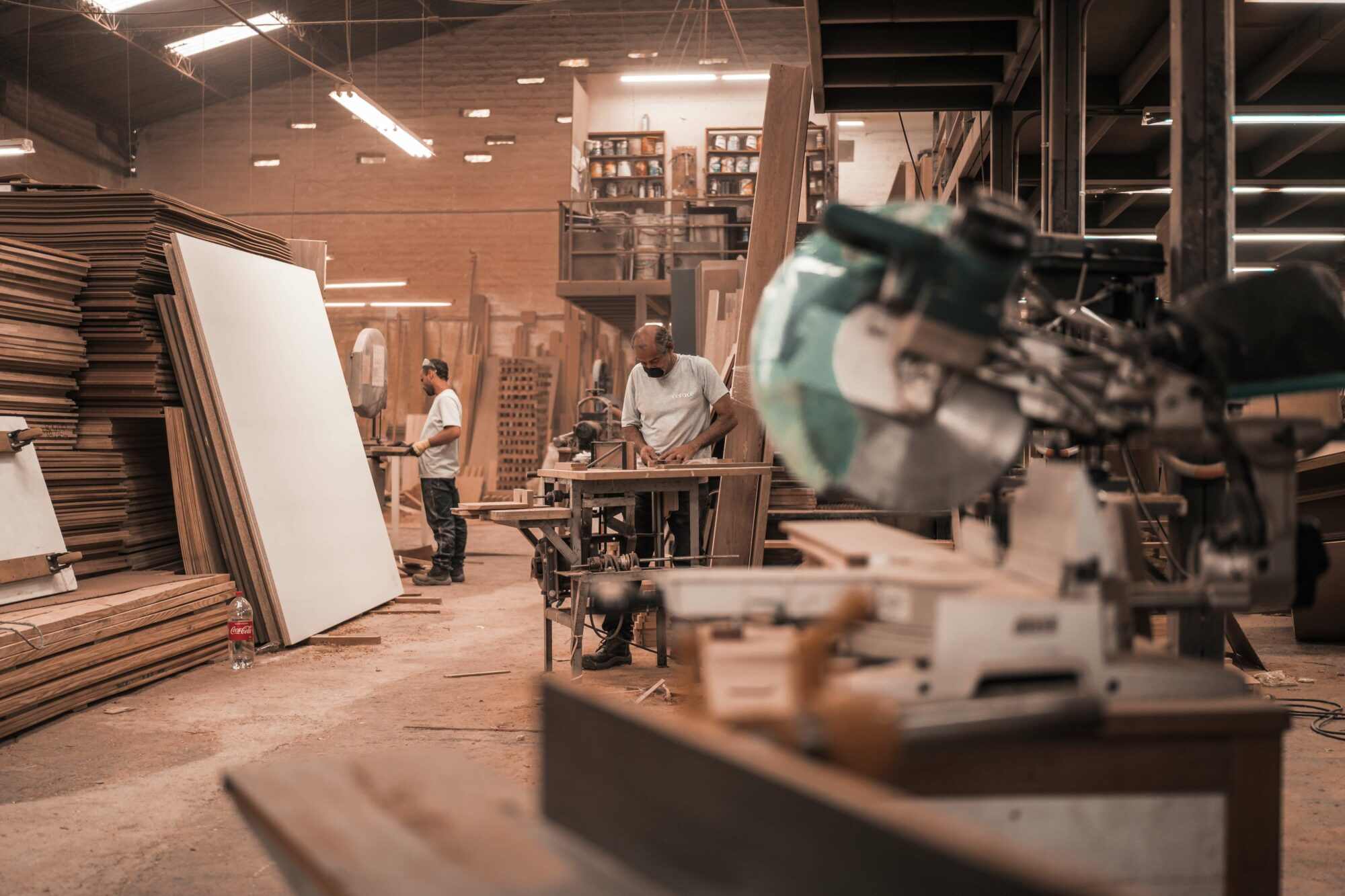 Stock carpentry image of workers cutting wood.